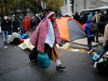 Inmigrantes en un campamento de París
