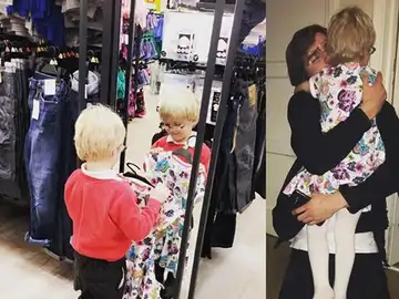 El niño probándose su vestido El niño probándose su vestido