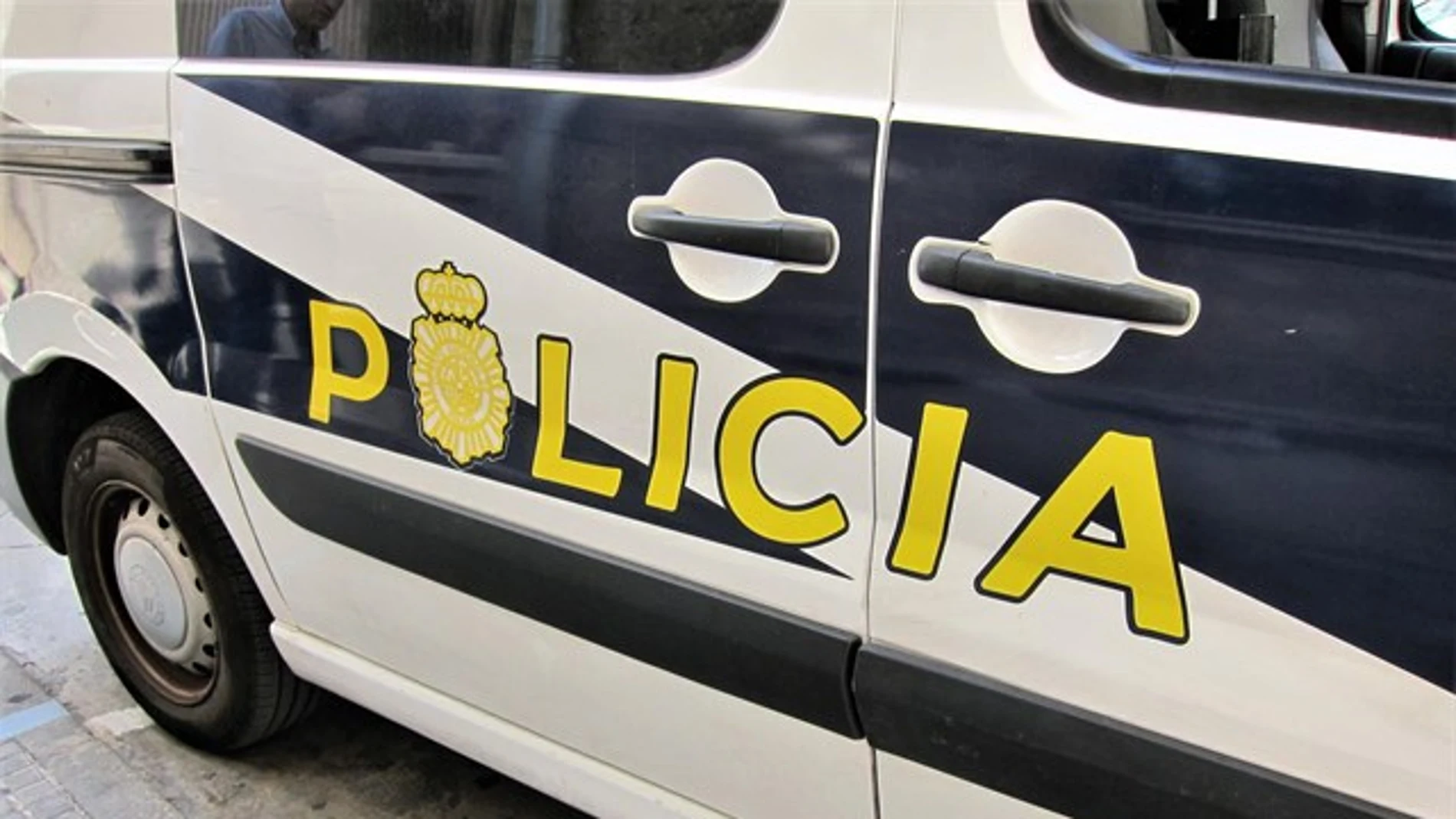 Un coche de la Policía. Un coche de la Policía.