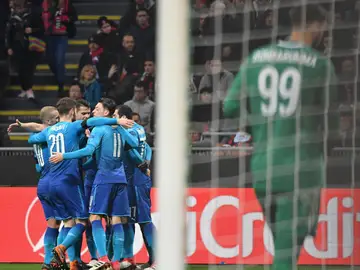 Los jugadores del Arsenal celebran un gol ante el Milan Los jugadores del Arsenal celebran un gol ante el Milan