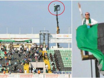 Aficionado sigue el partido desde una grúa Aficionado sigue el partido desde una grúa