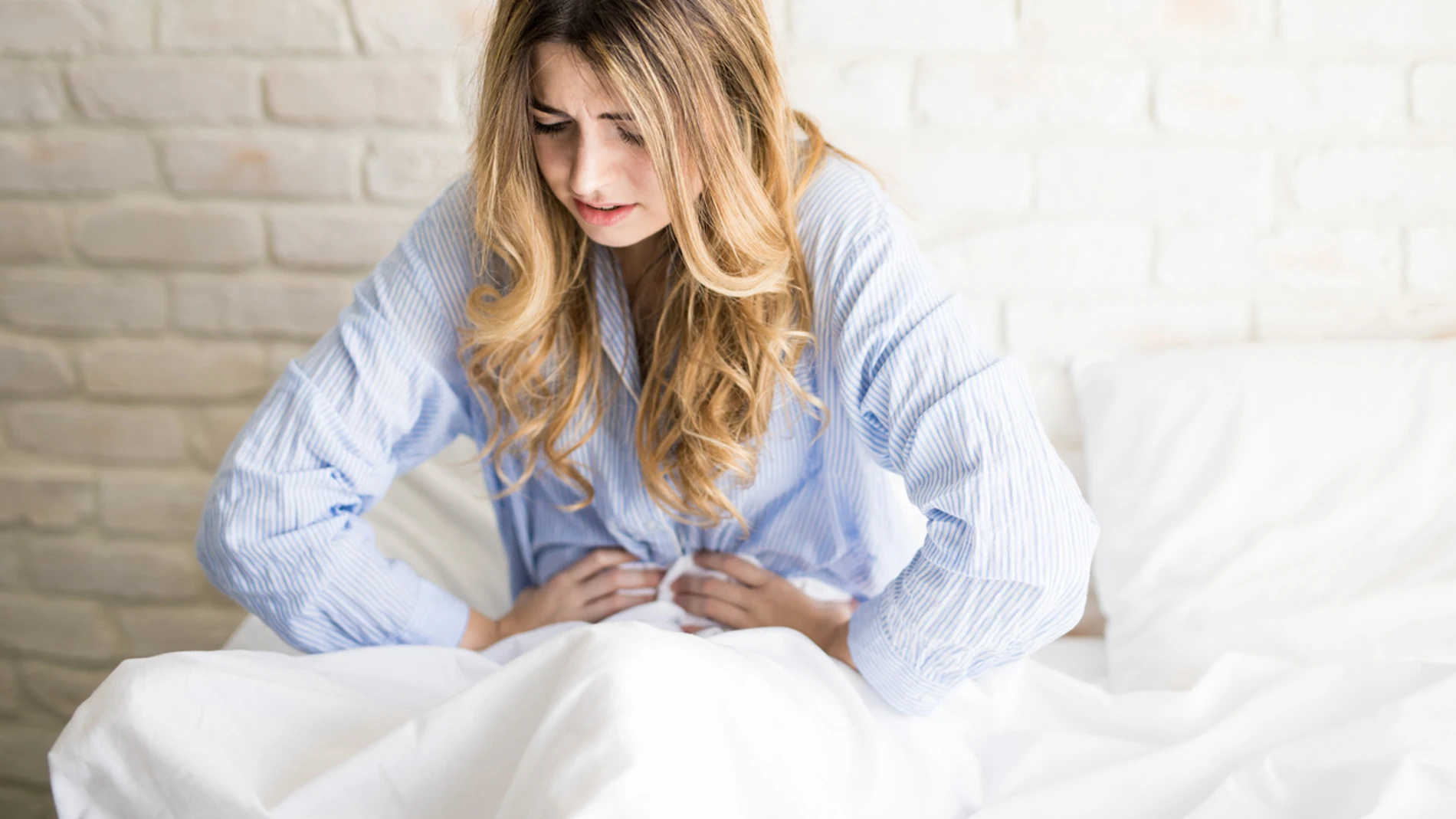 Una chica con la menstruación Una chica con la menstruación
