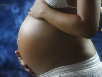 Imagen de archivo de una mujer embarazada. Imagen de archivo de una mujer embarazada.