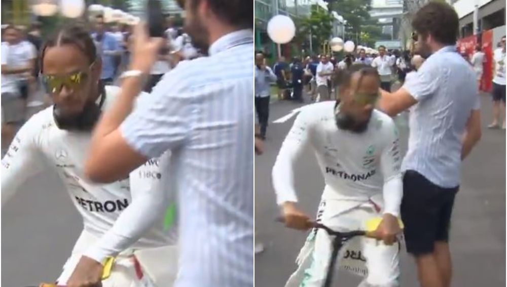 Hamilton choca con un aficionado y le tira el móvil al suelo