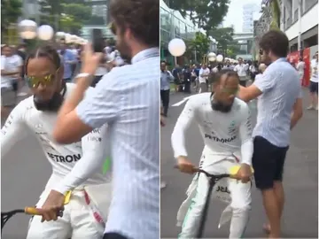 Hamilton choca con un aficionado y le tira el móvil al suelo Hamilton choca con un aficionado y le tira el móvil al suelo