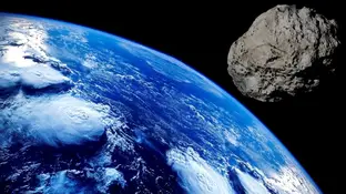 Un asteroide volando sobre la Tierra Un asteroide volando sobre la Tierra