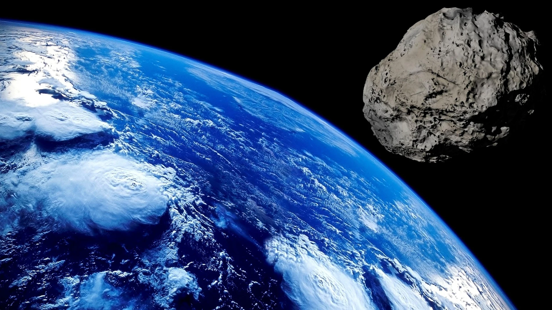 Un asteroide volando sobre la Tierra