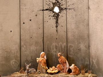 Banksy instala en Belén un provocador pesebre con muro y agujero de proyectil