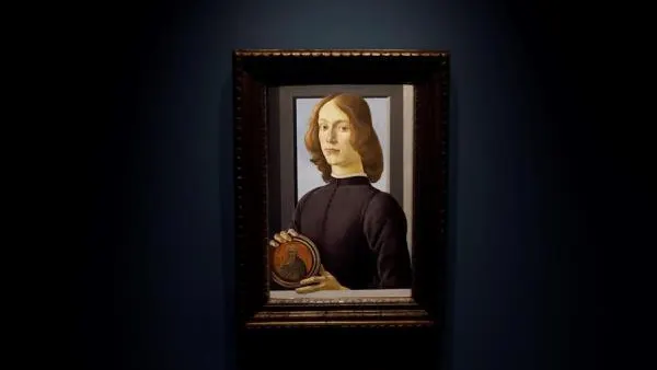 Young Man Holding a Roundel de Sandro Botticelli