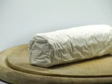 Imagen de un queso rulo de cabra Imagen de un queso rulo de cabra