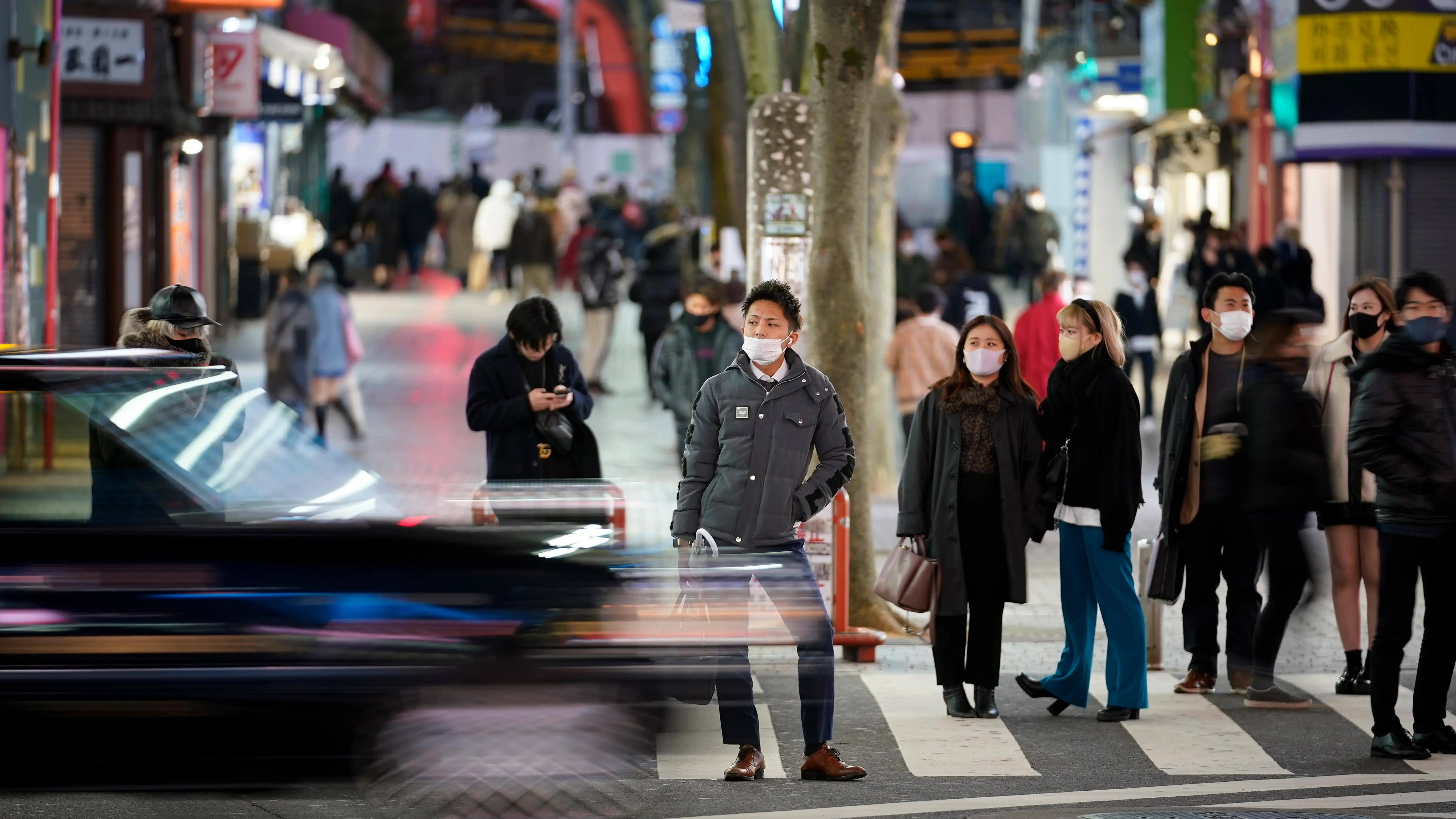 Personas en las calles de Japón con mascarilla por el coronavirus Personas en las calles de Japón con mascarilla por el coronavirus