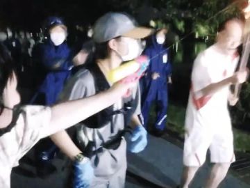 Detenida una mujer por disparar a la antorcha olímpica con una pistola de agua