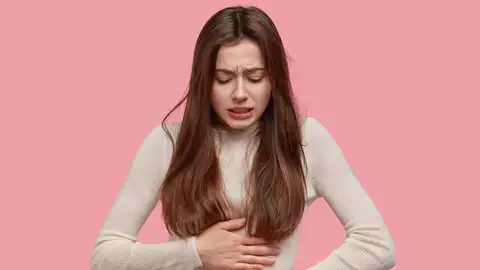 Una mujer con dolor menstrual Una mujer con dolor menstrual
