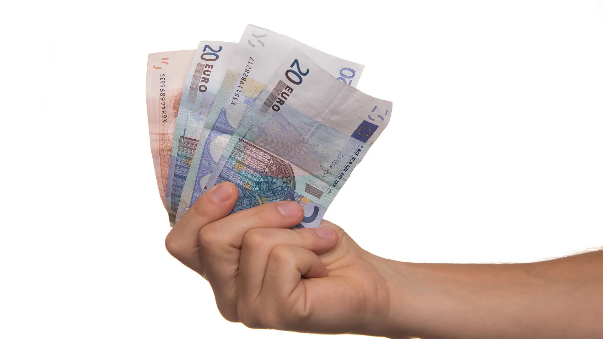 Una persona con billetes de euro en la mano Una persona con billetes de euro en la mano