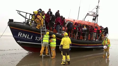 Migrantes en una barca Migrantes en una barca