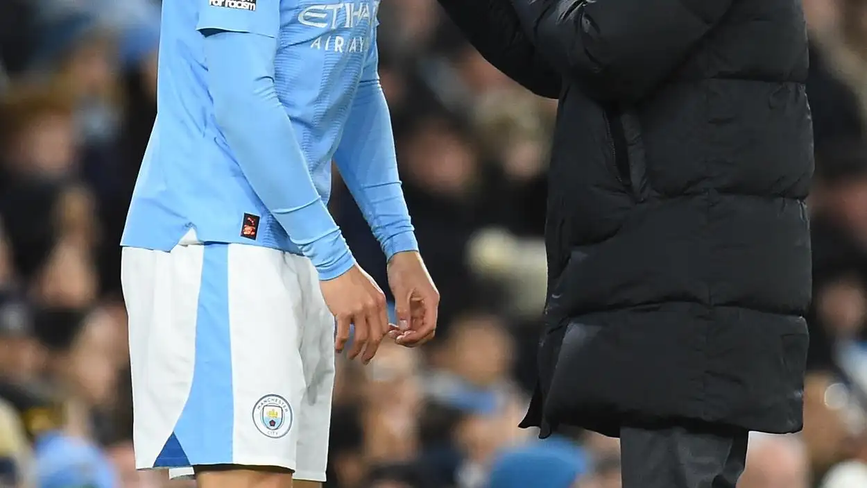 Guardiola y Haaland en un partido del City