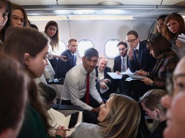UK Prime Minister Rishi Sunak speaks to journalists on board a plane on his way to Warsaw during his visit to Poland and Germany. 