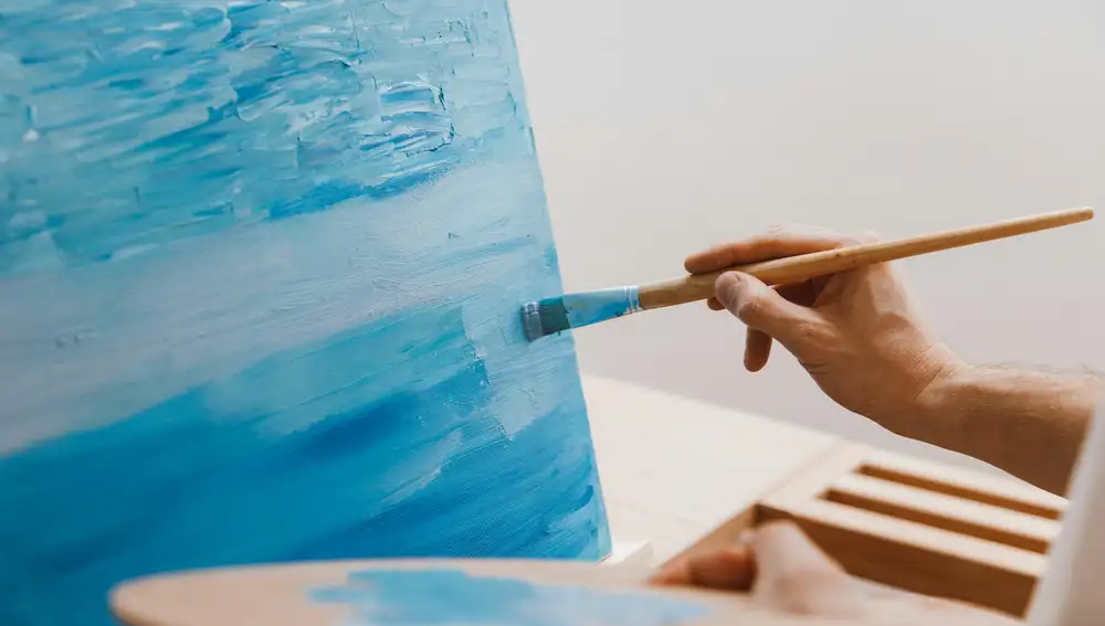 Artista pintando un óleo Artista pintando un óleo