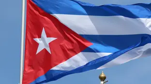 La bandera de Cuba ondeando. La bandera de Cuba ondeando.